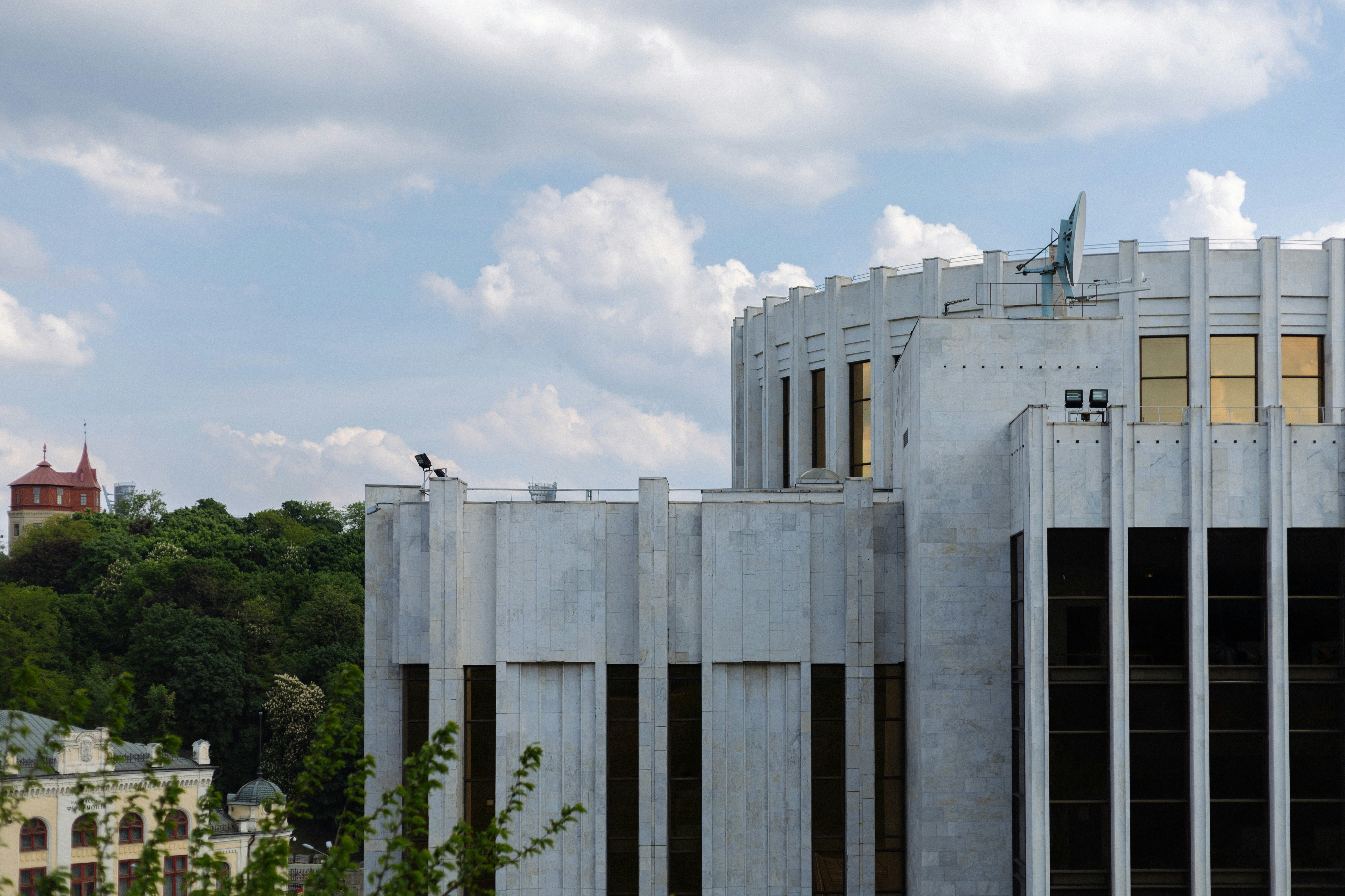 a tall building with a clock tower in the background